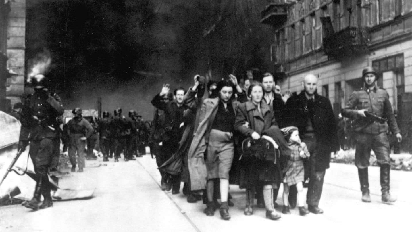 Jewish prisoners being led out of the Warsaw Ghetto following the uprising in 1943. Credit: WWII War Crimes Records