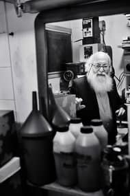Adolfo Kaminsky in a darkroom in 2014. As a teenager in World War II, he forged passports for French Jews. RAPHAEL ZUBLER