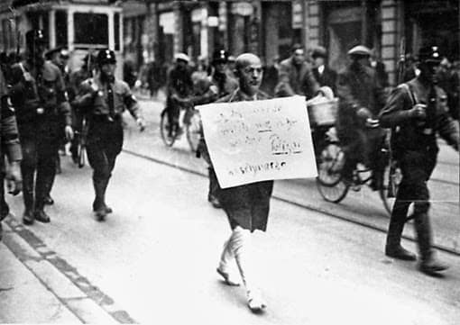 This is a photo shot on the streets of Munich, Germany on 10th March 1933; just six weeks after Hitler came to power. The picture, published across the world and later in many history books, was a chilling portent of the hellish events that were about to consume Germany and much of the rest of the planet. Many have seen this photo, but few know the background behind it.