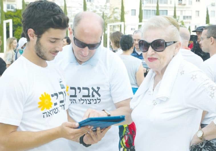 AVIV VOLUNTEERS aid a client.. (photo credit:Courtesy)