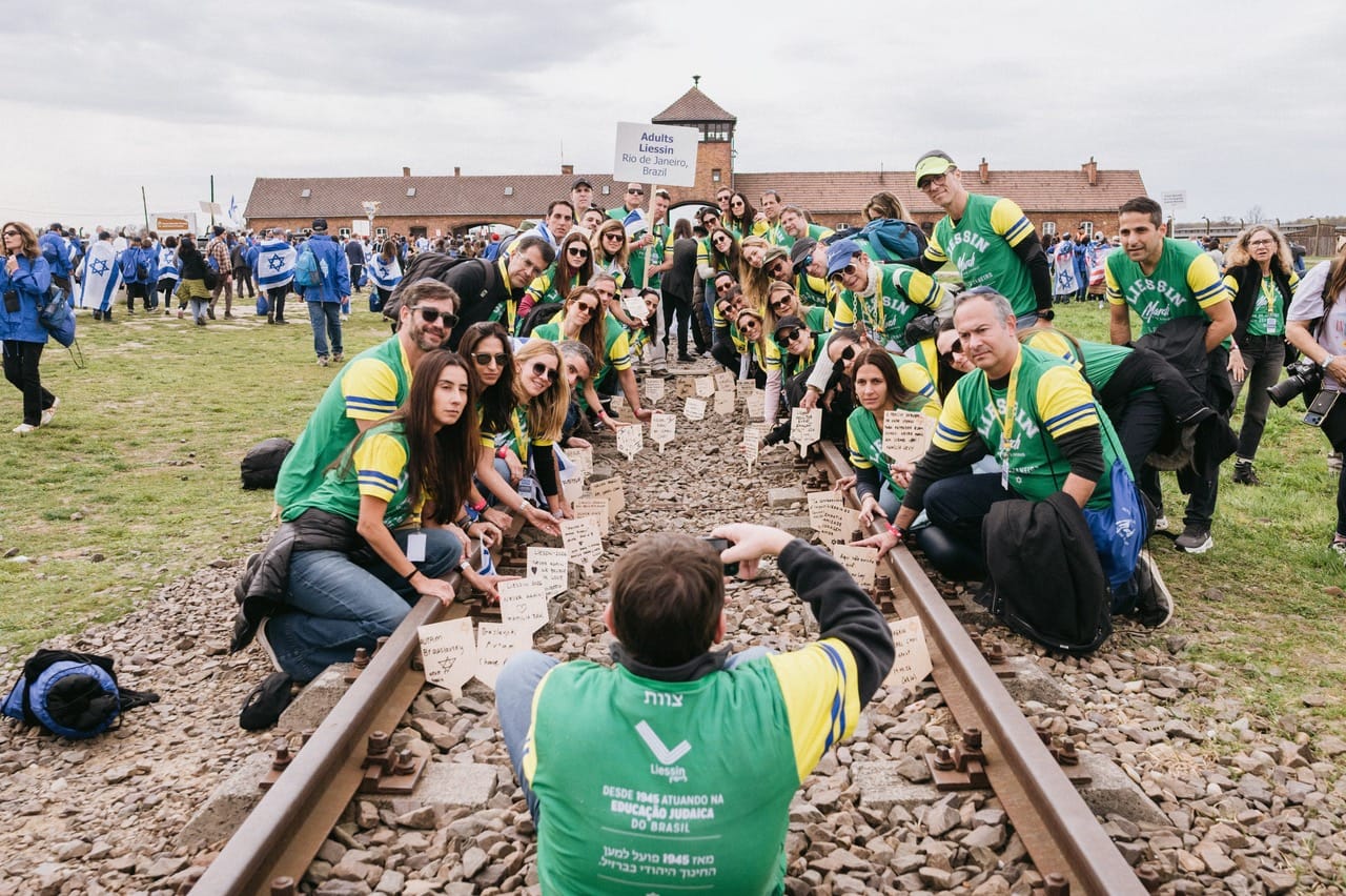 The Brazilian delegation on the railway tracks at Birkenau